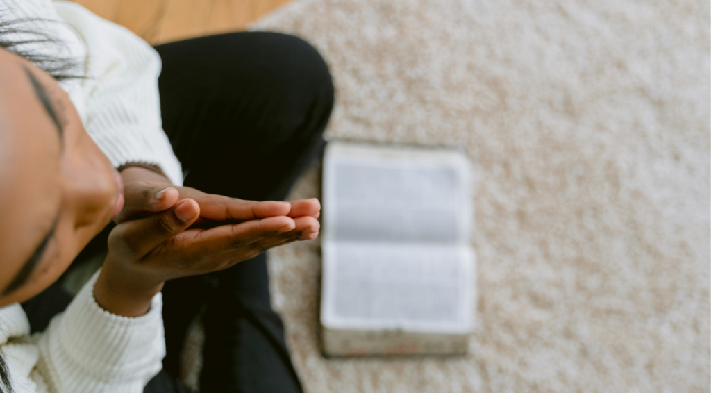 person praying for exams in the morning before test day