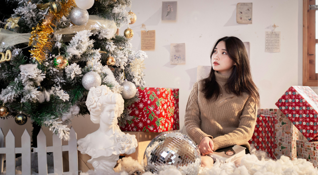 A girl celebrating merry christmas wishes