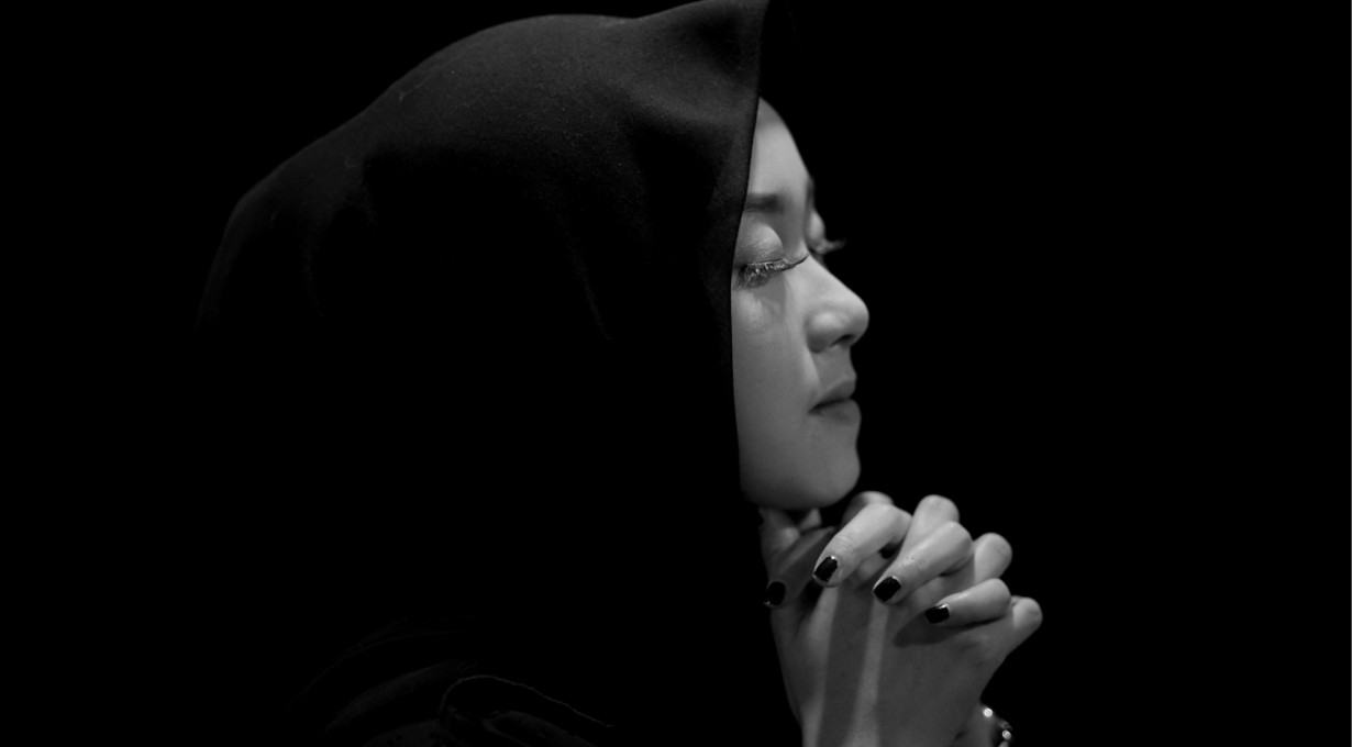 A girl doing prayers for strength