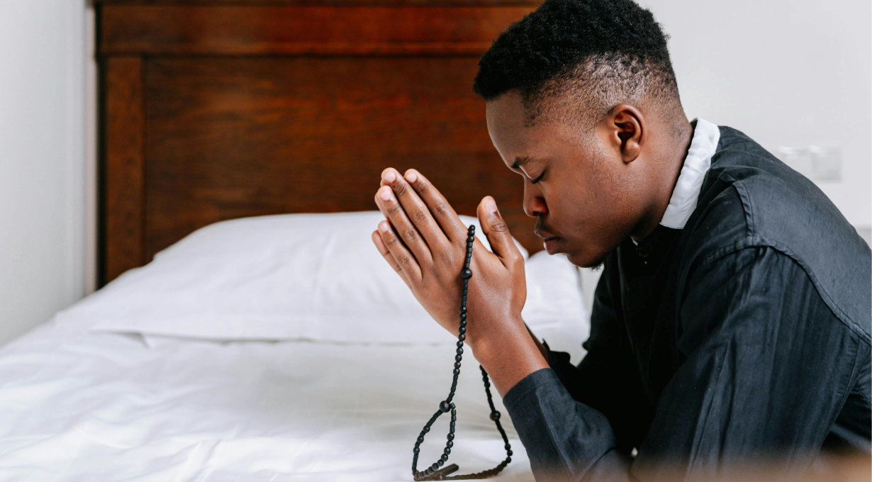 Bedtime prayers for peace and rest; a man praying before sleep