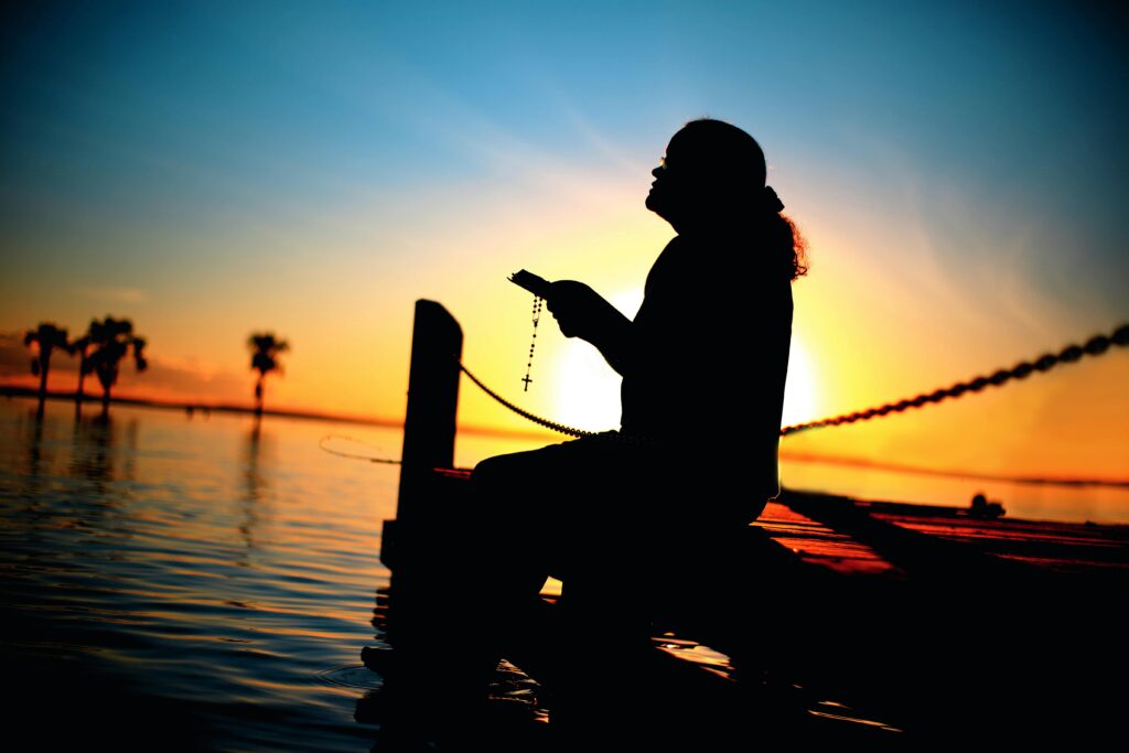 1.	Woman saying good morning prayers at sunrise 