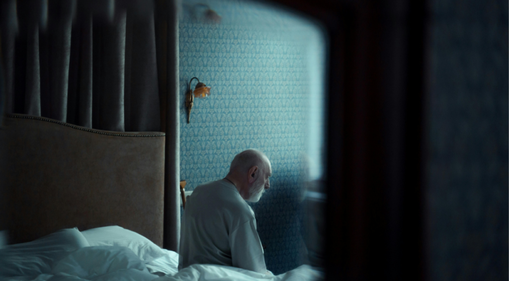 A man doing night prayers on his bed before sleeping