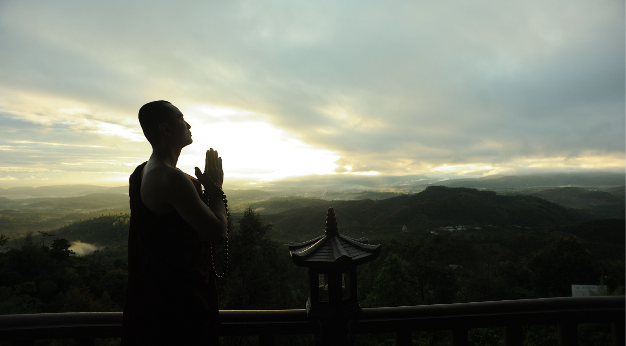A man praying for morning during sunrise