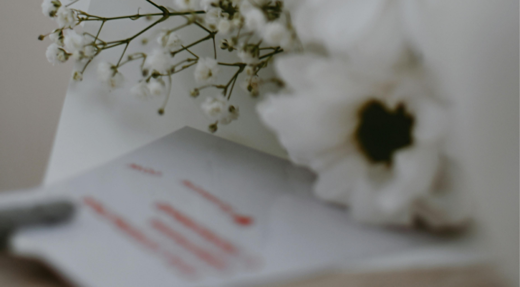 flowers with a card with get well soon wishes written on it